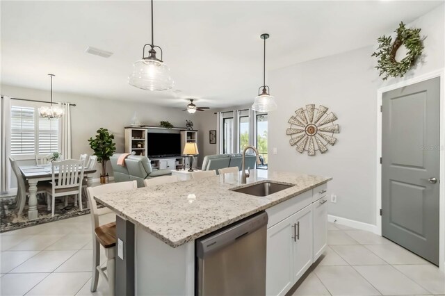 5165 Coral Reef Way, Bradenton, FL 34211 - kitchen featuring stainless steel dishwasher, a sink, a kitchen island with sink, ceiling fan, and light tile patterned flooring