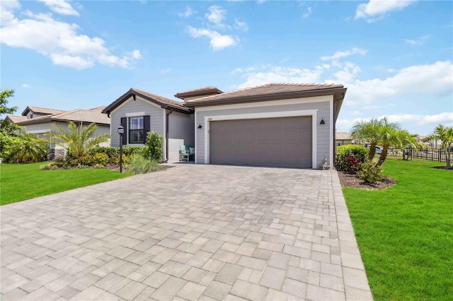 5165 Coral Reef Way, Bradenton, FL 34211 - ranch-style house featuring decorative driveway, a front yard, a garage, and a tile roof