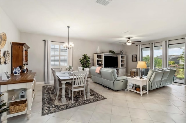 5165 Coral Reef Way, Bradenton, FL 34211 - dining space featuring plenty of natural light, a chandelier, ceiling fan, and light tile patterned floors