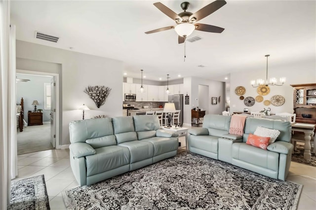 5165 Coral Reef Way, Bradenton, FL 34211 - living room with a ceiling fan, light tile patterned floors, recessed lighting, and a chandelier