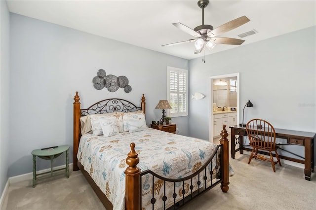 5165 Coral Reef Way, Bradenton, FL 34211 - carpeted bedroom featuring baseboards, ensuite bath, and ceiling fan