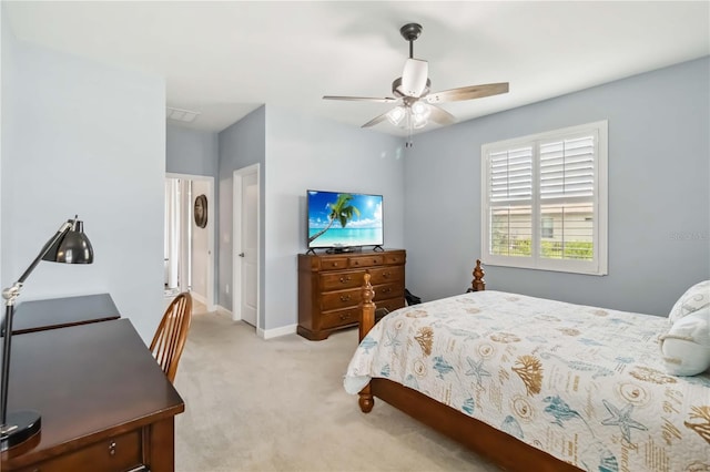 5165 Coral Reef Way, Bradenton, FL 34211 - bedroom with light carpet, a ceiling fan, and baseboards