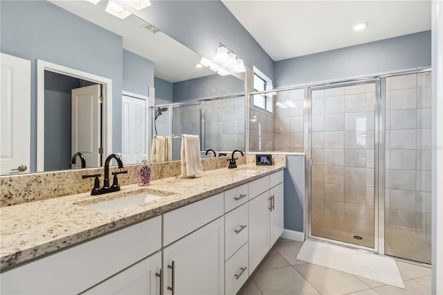5165 Coral Reef Way, Bradenton, FL 34211 - full bath featuring a stall shower, tile patterned floors, and double vanity