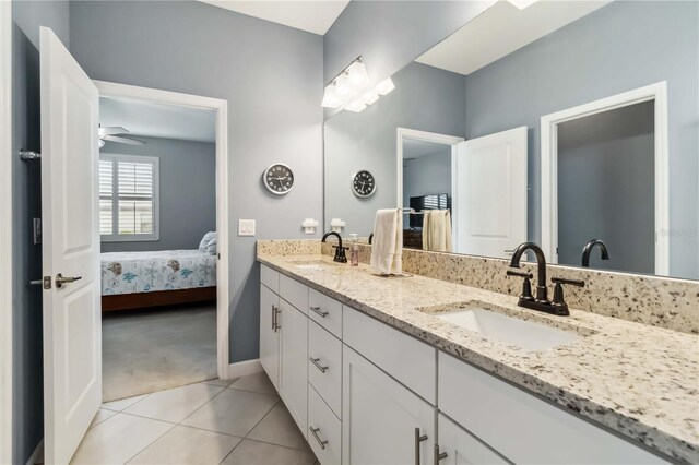 5165 Coral Reef Way, Bradenton, FL 34211 - ensuite bathroom with tile patterned floors, baseboards, and double vanity