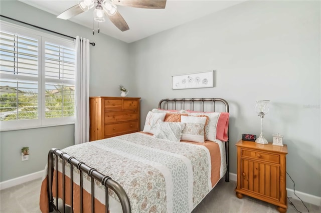 5165 Coral Reef Way, Bradenton, FL 34211 - bedroom with light carpet, baseboards, and a ceiling fan