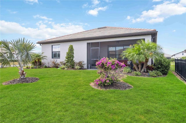 5165 Coral Reef Way, Bradenton, FL 34211 - back of property featuring stucco siding, a tiled roof, and a sunroom