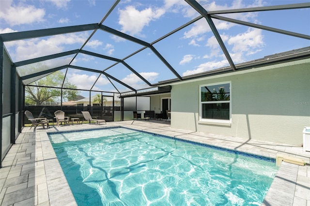 swimming pool featuring a patio and a lanai