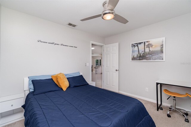 bedroom with carpet, baseboards, and a ceiling fan
