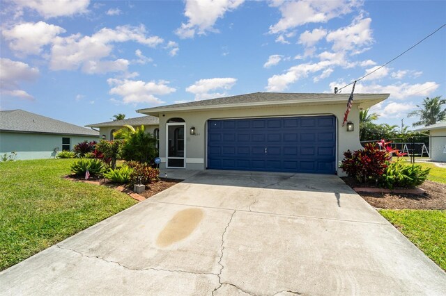 single story home with stucco siding, concrete driveway, a garage, and a front lawn