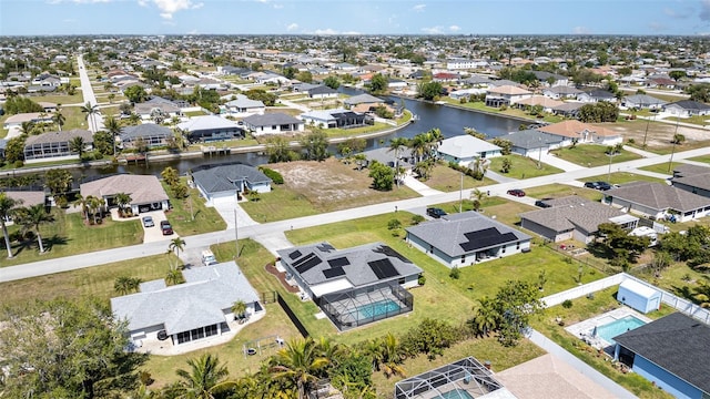 aerial view of residential area with a nearby body of water