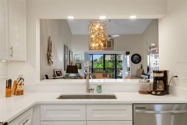 5632 Ashton Lake Dr Unit 5632, Sarasota, FL 34231 - kitchen with dishwasher, white cabinetry, open floor plan, a sink, and light countertops