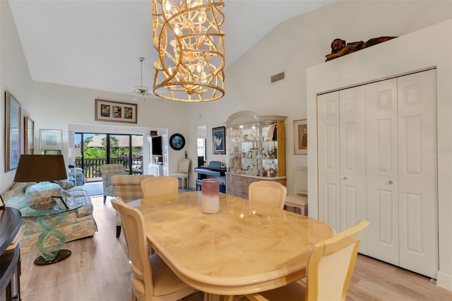 5632 Ashton Lake Dr Unit 5632, Sarasota, FL 34231 - dining room with light wood-style floors, a chandelier, and high vaulted ceiling