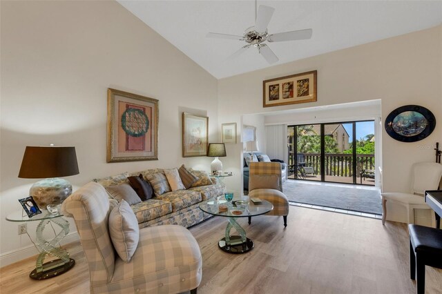 5632 Ashton Lake Dr Unit 5632, Sarasota, FL 34231 - living room with wood finished floors, high vaulted ceiling, ceiling fan, and baseboards