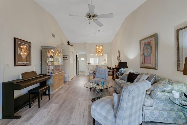 5632 Ashton Lake Dr Unit 5632, Sarasota, FL 34231 - living room with high vaulted ceiling, a chandelier, light wood finished floors, and ceiling fan