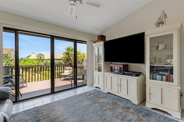 5632 Ashton Lake Dr Unit 5632, Sarasota, FL 34231 - unfurnished living room with lofted ceiling, a ceiling fan, and tile patterned flooring