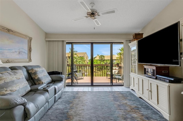 5632 Ashton Lake Dr Unit 5632, Sarasota, FL 34231 - living area featuring a ceiling fan, plenty of natural light, a textured ceiling, and light tile patterned floors