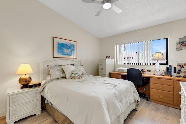 5632 Ashton Lake Dr Unit 5632, Sarasota, FL 34231 - bedroom with vaulted ceiling, light wood-style floors, a ceiling fan, and a desk