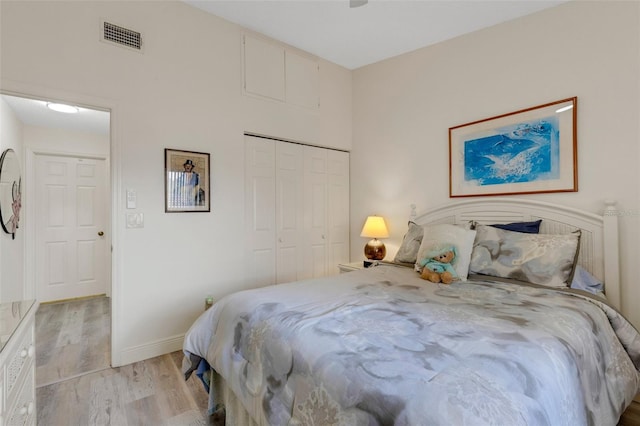 5632 Ashton Lake Dr Unit 5632, Sarasota, FL 34231 - bedroom with light wood-type flooring, a closet, and baseboards