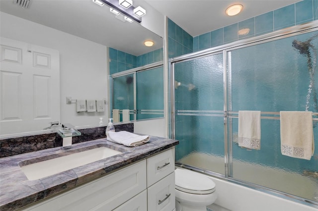 5632 Ashton Lake Dr Unit 5632, Sarasota, FL 34231 - bathroom featuring shower / bath combination with glass door, vanity, and toilet