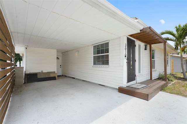 3616 Stardust Pl, Sarasota, FL 34232 - view of patio featuring an attached carport