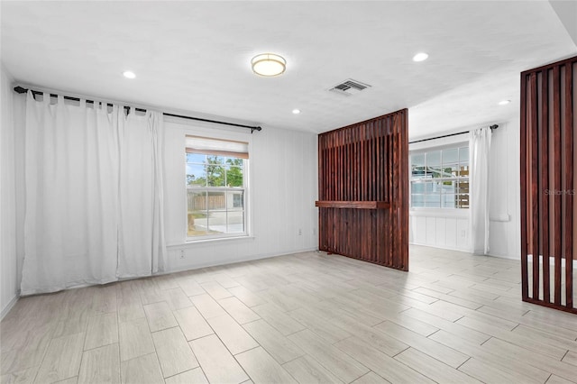 3616 Stardust Pl, Sarasota, FL 34232 - spare room featuring light wood-style floors and recessed lighting