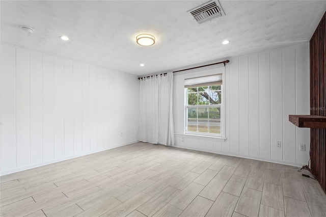 3616 Stardust Pl, Sarasota, FL 34232 - spare room featuring light wood-style flooring, recessed lighting, and baseboards