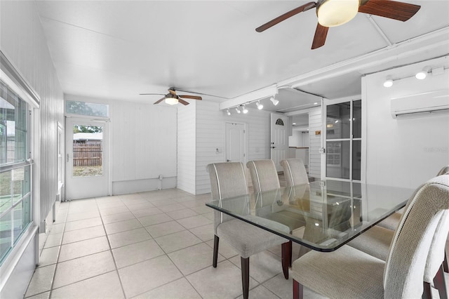 3616 Stardust Pl, Sarasota, FL 34232 - dining space with ceiling fan, an AC wall unit, light tile patterned floors, and rail lighting
