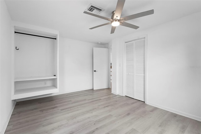 3616 Stardust Pl, Sarasota, FL 34232 - unfurnished bedroom featuring wood finished floors and a ceiling fan