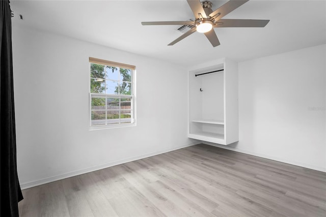 3616 Stardust Pl, Sarasota, FL 34232 - unfurnished bedroom with wood finished floors, ceiling fan, and baseboards