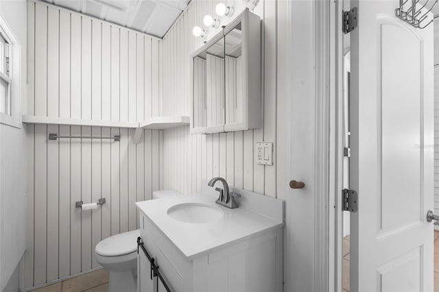 3616 Stardust Pl, Sarasota, FL 34232 - bathroom featuring vanity, toilet, and tile patterned floors
