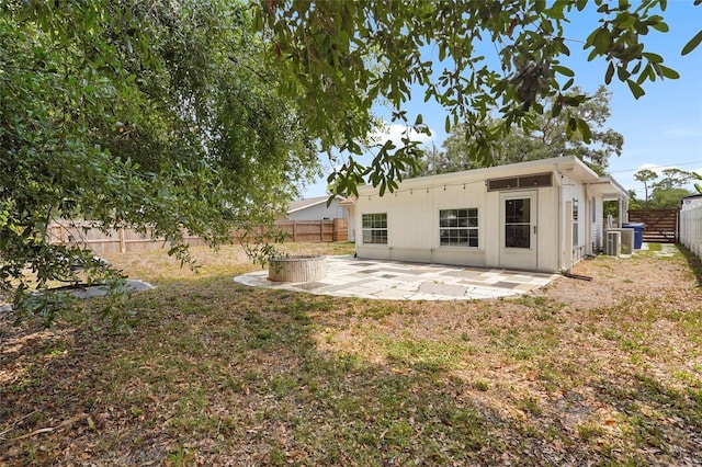 3616 Stardust Pl, Sarasota, FL 34232 - rear view of property featuring a fenced backyard, a patio area, and cooling unit