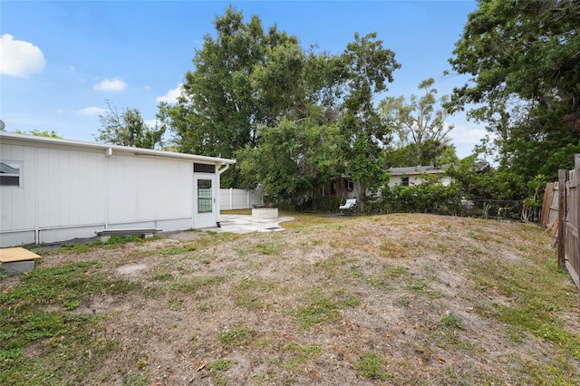 3616 Stardust Pl, Sarasota, FL 34232 - fenced backyard with a patio area