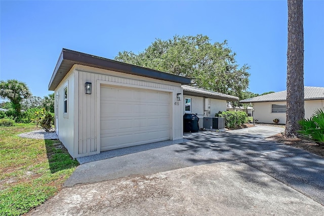 415 Courbet Dr Unit 415, Nokomis, FL 34275 - garage with driveway and central AC