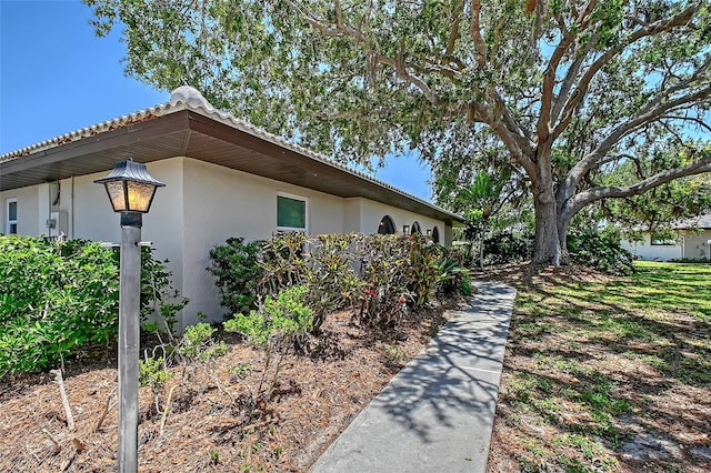 415 Courbet Dr Unit 415, Nokomis, FL 34275 - view of property exterior featuring stucco siding