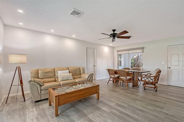 415 Courbet Dr Unit 415, Nokomis, FL 34275 - living area featuring wood finished floors, ceiling fan, recessed lighting, a textured ceiling, and baseboards