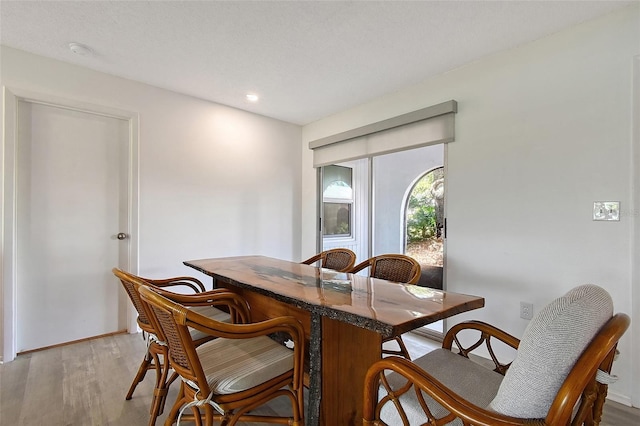 415 Courbet Dr Unit 415, Nokomis, FL 34275 - dining area featuring light wood-style floors, baseboards, and recessed lighting