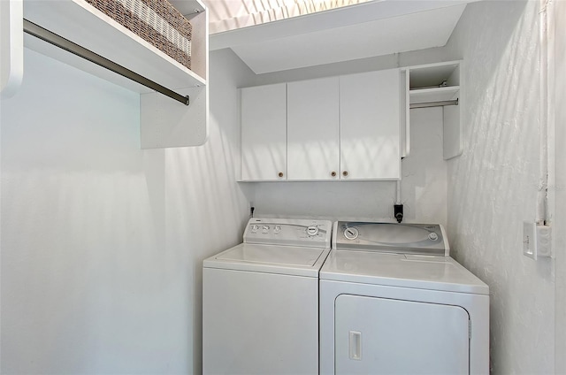 415 Courbet Dr Unit 415, Nokomis, FL 34275 - laundry area featuring independent washer and dryer and cabinet space