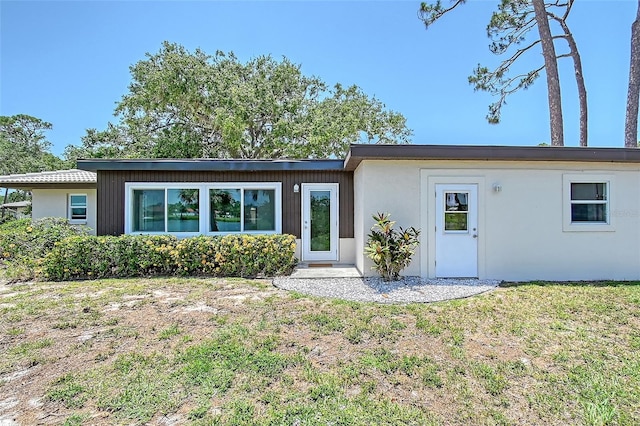 415 Courbet Dr Unit 415, Nokomis, FL 34275 - view of front of house with a front yard