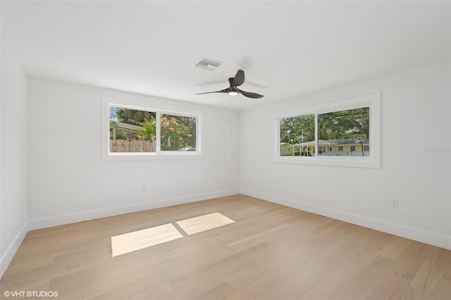 2655 Bay St, Sarasota, FL 34237 - unfurnished room with light wood finished floors, baseboards, and ceiling fan