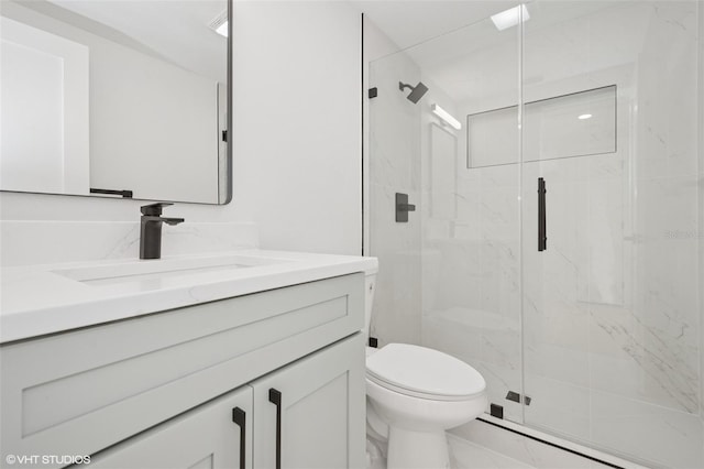 2655 Bay St, Sarasota, FL 34237 - full bath featuring toilet, marble finish floor, vanity, and a marble finish shower