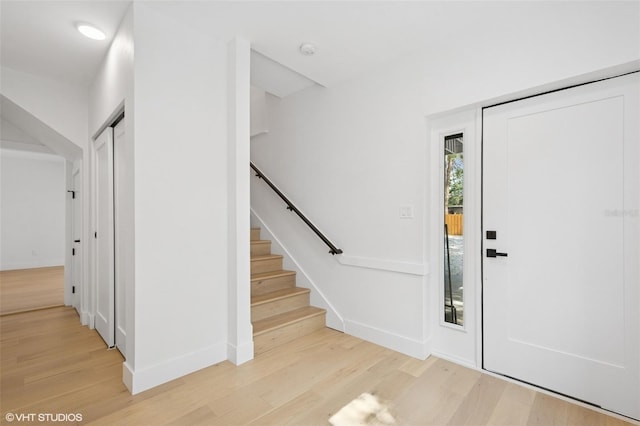 2655 Bay St, Sarasota, FL 34237 - foyer entrance with baseboards, stairway, and light wood-type flooring