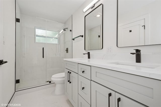 2655 Bay St, Sarasota, FL 34237 - bathroom featuring double vanity, toilet, a marble finish shower, a sink, and marble finish floor