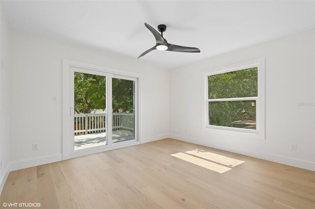 2655 Bay St, Sarasota, FL 34237 - spare room featuring plenty of natural light, wood finished floors, and baseboards