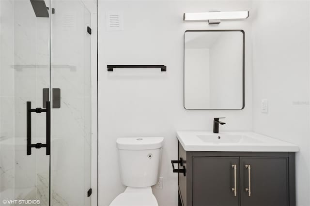 2655 Bay St, Sarasota, FL 34237 - full bathroom featuring a marble finish shower, vanity, and toilet
