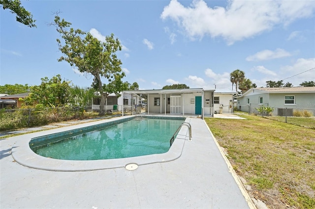 view of swimming pool featuring a patio and central AC