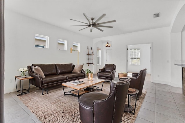 4315 Deep Creek Ter, Parrish, FL 34219 - living room featuring arched walkways, light tile patterned floors, and a ceiling fan
