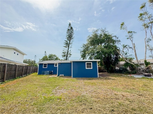 rear view of property with cooling unit