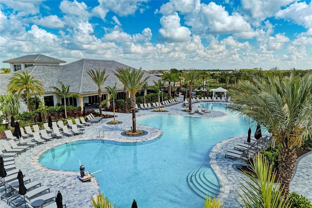 community pool featuring a patio area