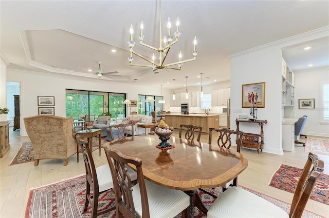 dining room with light wood-style floors, ornamental molding, plenty of natural light, a chandelier, and recessed lighting