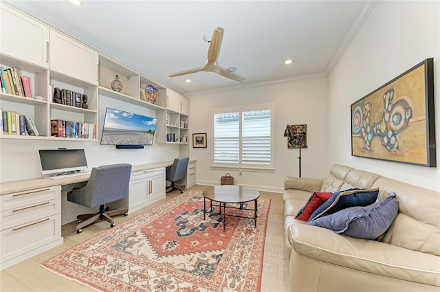 office featuring built in desk, ornamental molding, a ceiling fan, recessed lighting, and baseboards